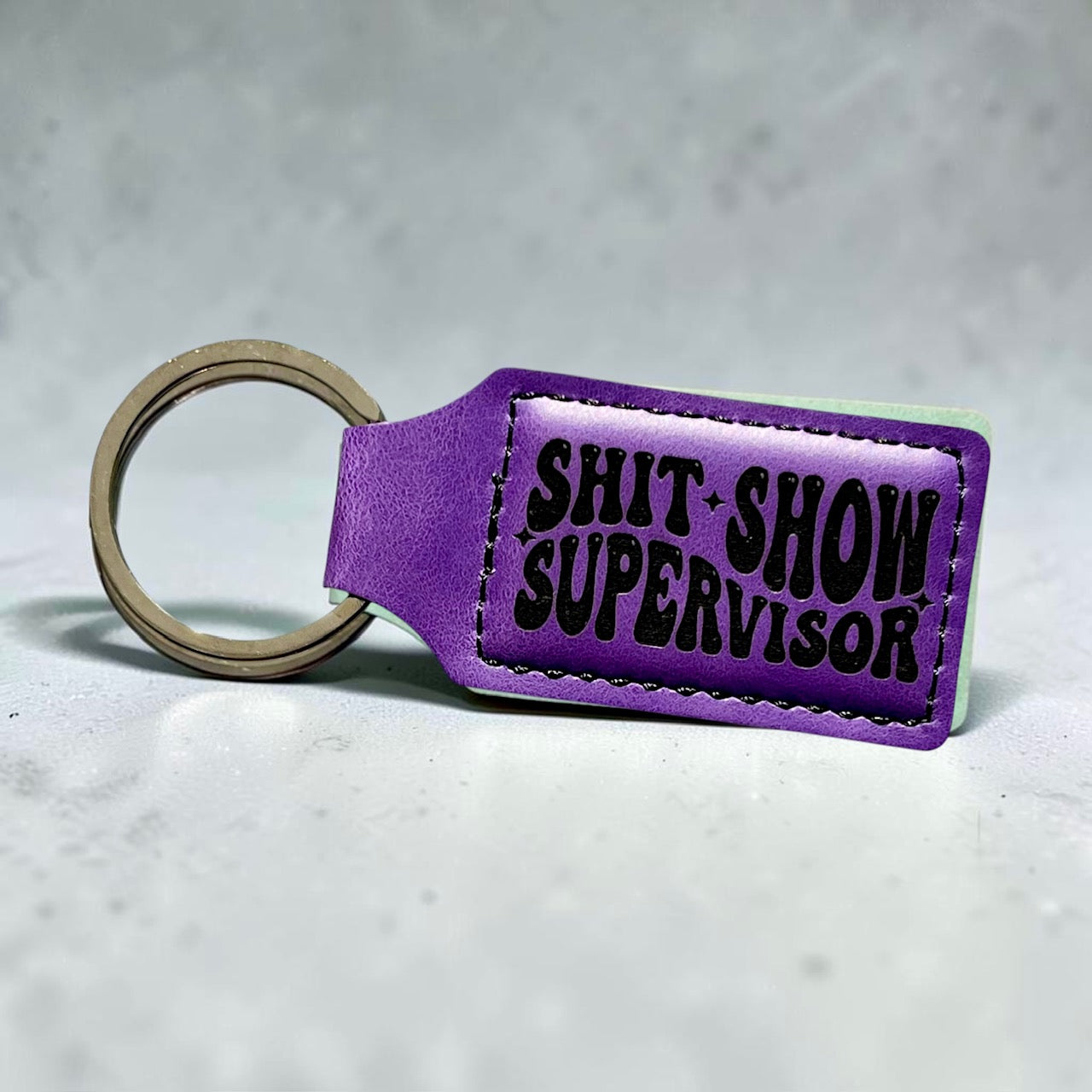 shit-show-supervisor-violet-keychain
